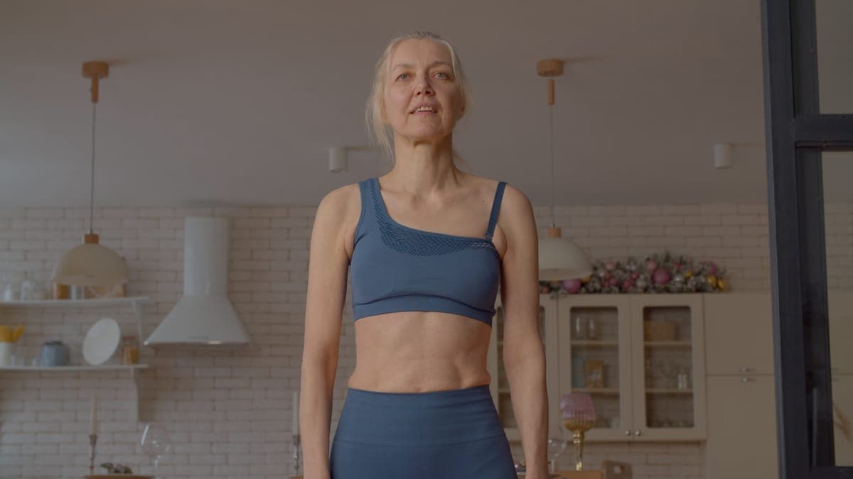 Woman measuring her waist, representing metabolic health awareness
