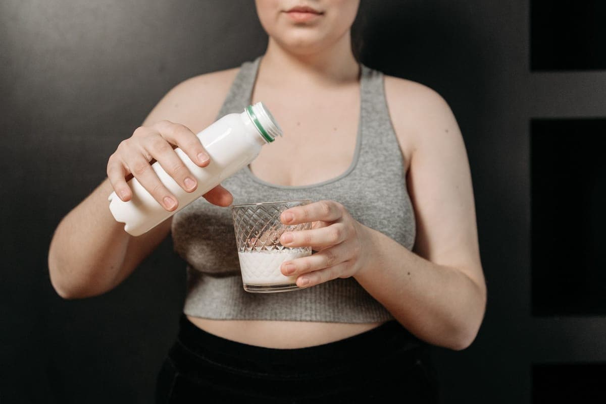Woman performing strength training exercise to maintain muscle mass