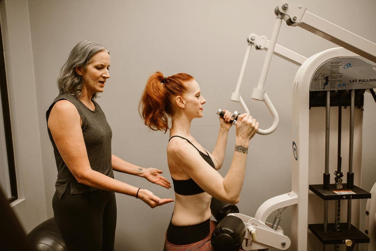 Woman performing gentle postpartum core activation exercises at home