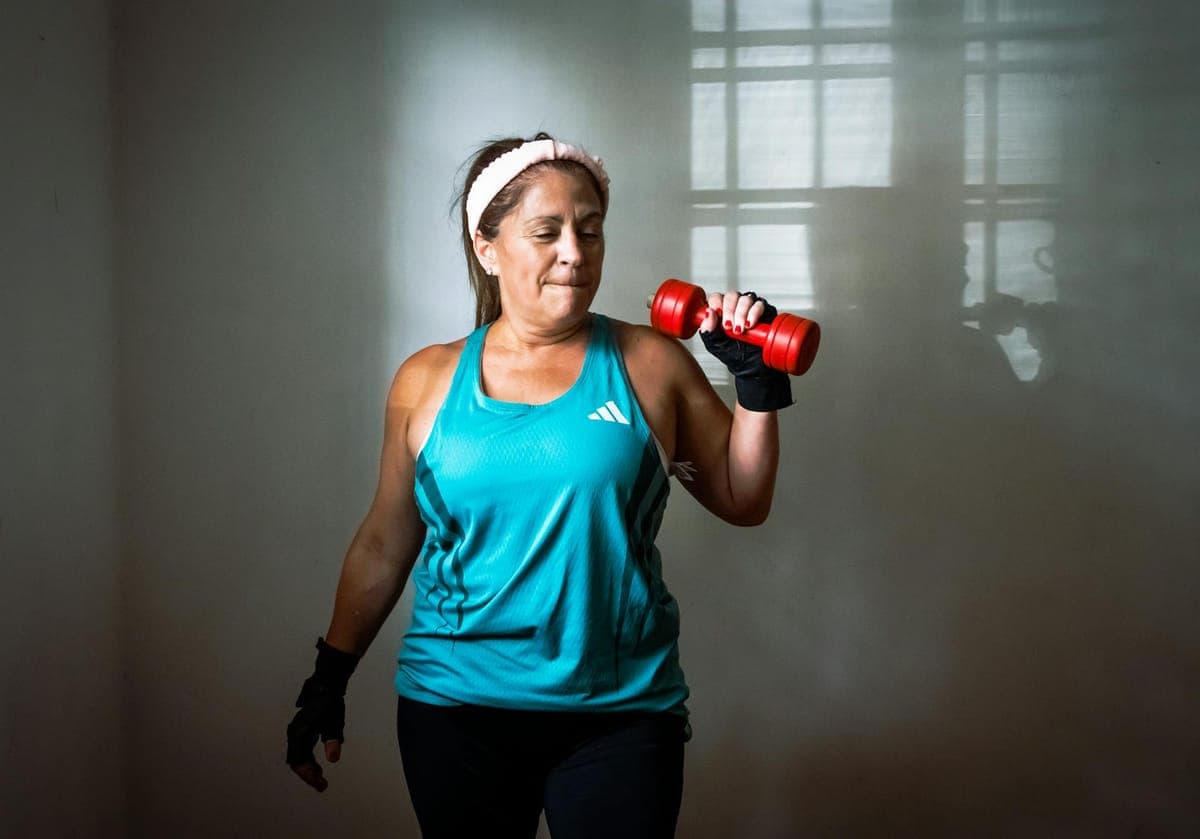 Woman stretching outdoors, representing hormonal changes and midlife fitness